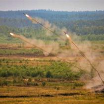 photo of a UR-77 Meteorit mine clearing vehicle throws line charges 98 yards long, which explode and detonate nearby mines in a 6-yard-wide path. The Ukrainian and Russian armies both use this AEV.